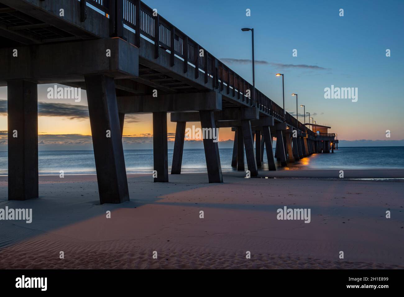 Gulf State Park fishing pier at dawn on the beach of Gulf Shores