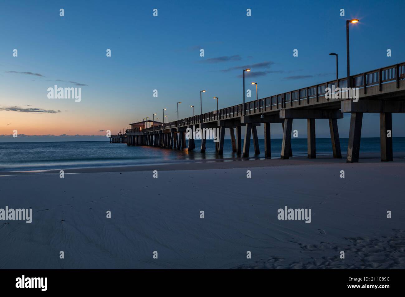 Gulf State Park fishing pier at dawn on the beach of Gulf Shores, Alabama Stock Photo