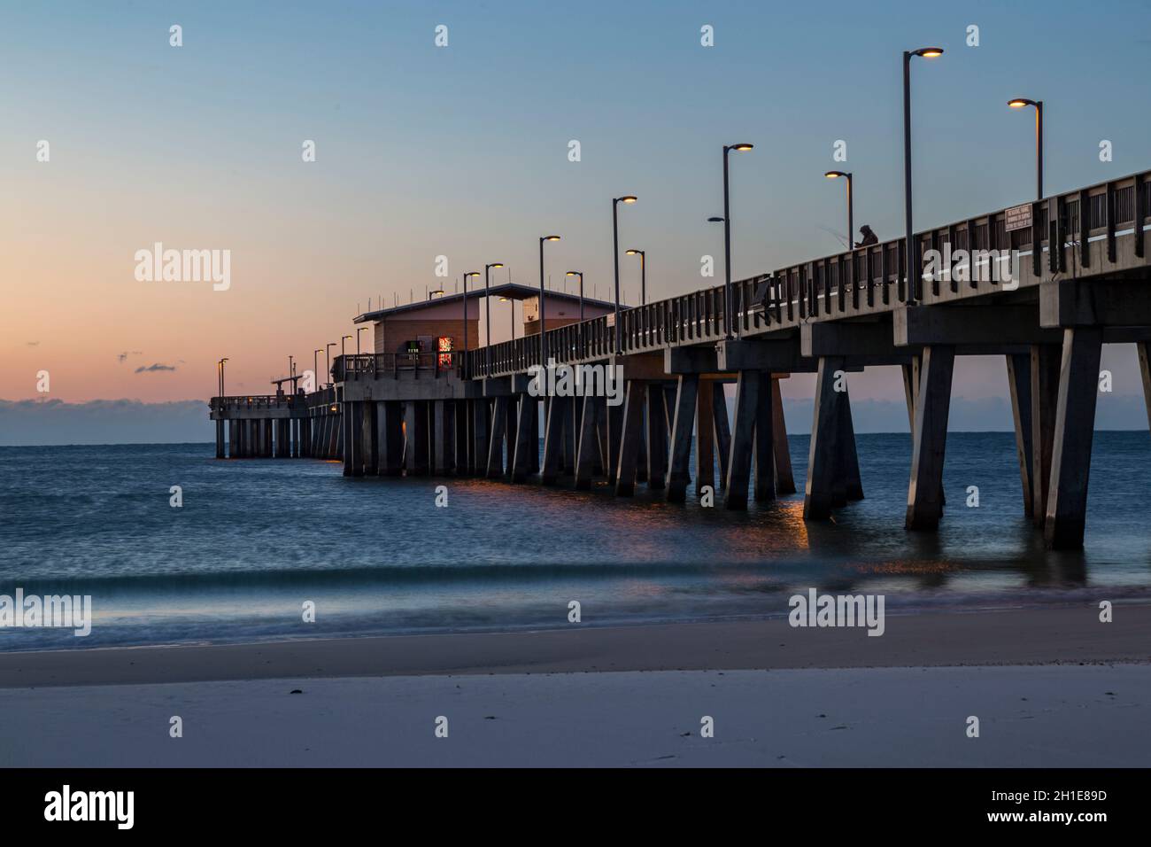 Gulf State Park fishing pier at dawn on the beach of Gulf Shores