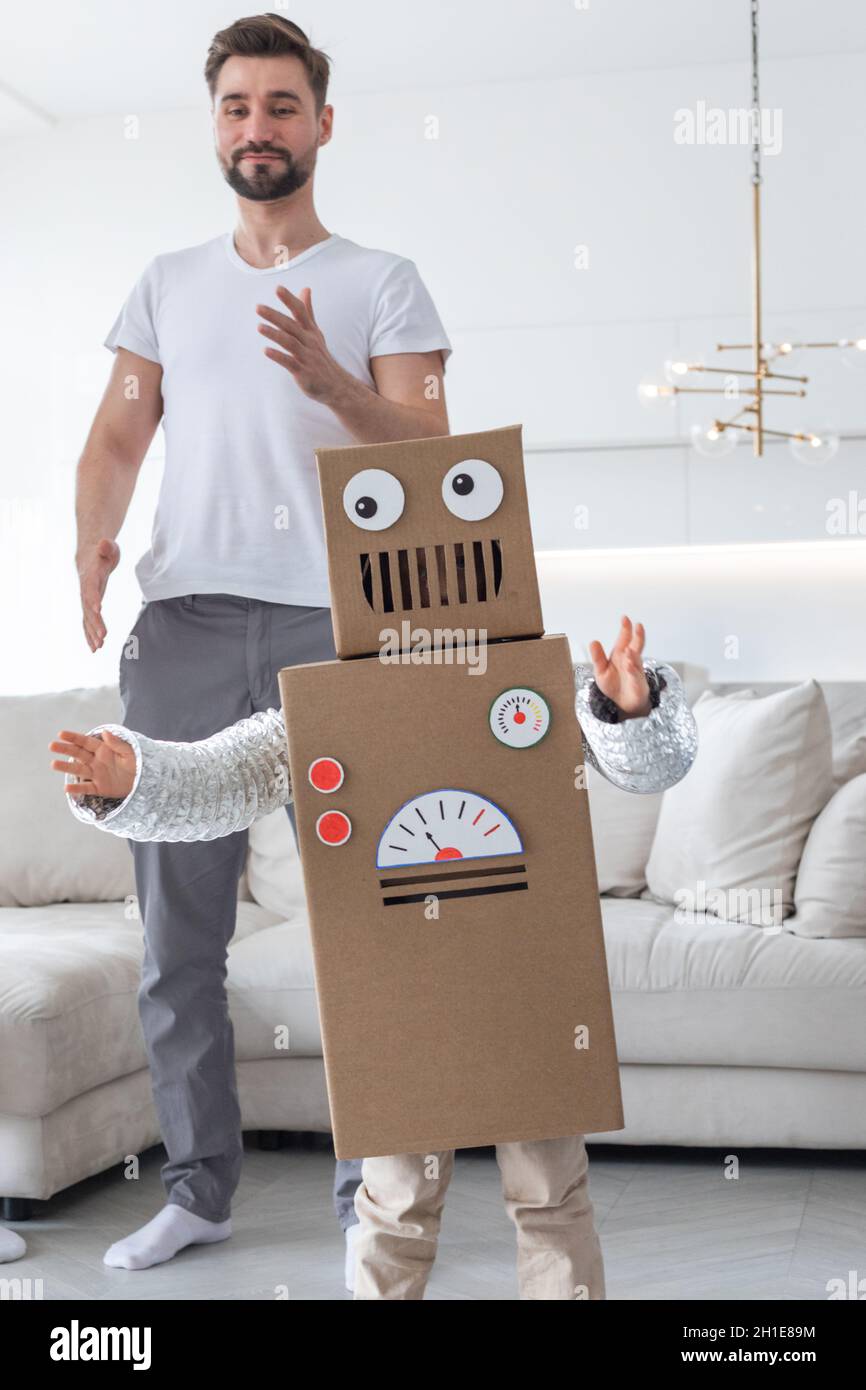 Boy wearing cardboard robot costume Stock Photo - Alamy