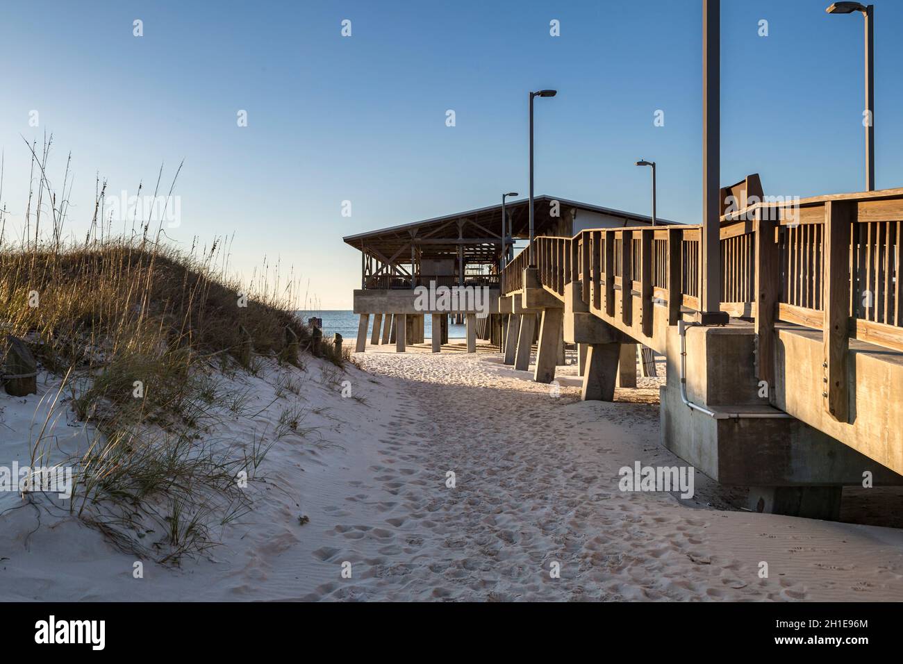 Gulf State Park fishing pier at dawn on the beach of Gulf Shores, Alabama Stock Photo