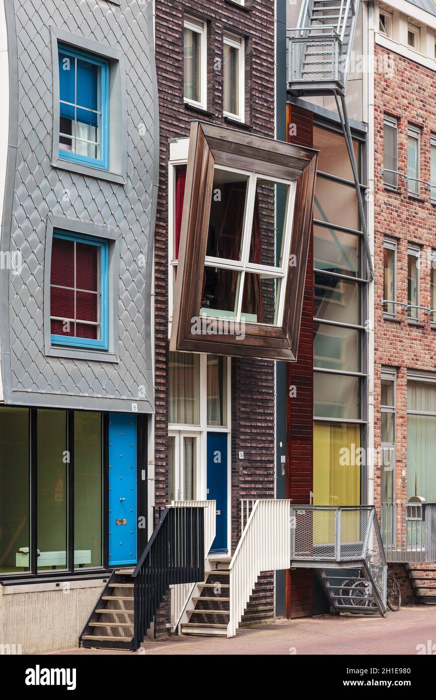 Row of newly built Dutch contemporary canal houses in Amsterdam, The Netherlands Stock Photo