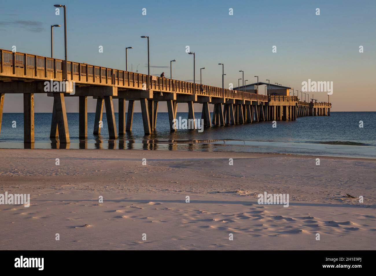 Gulf State Park fishing pier at dusk on the beach of Gulf Shores, Alabama Stock Photo