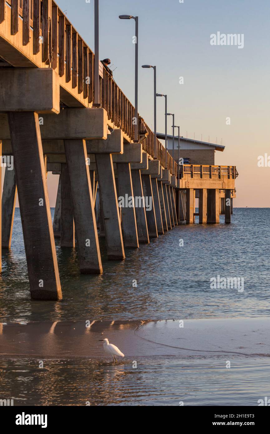 Gulf State Park fishing pier at dusk on the beach of Gulf Shores, Alabama Stock Photo