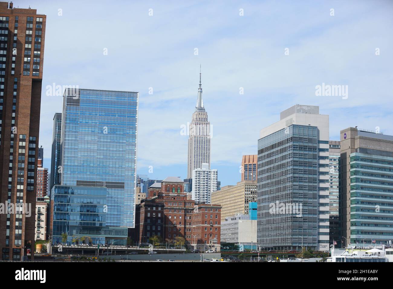 A view of the Manhattan skyline from the East River in New York City ...