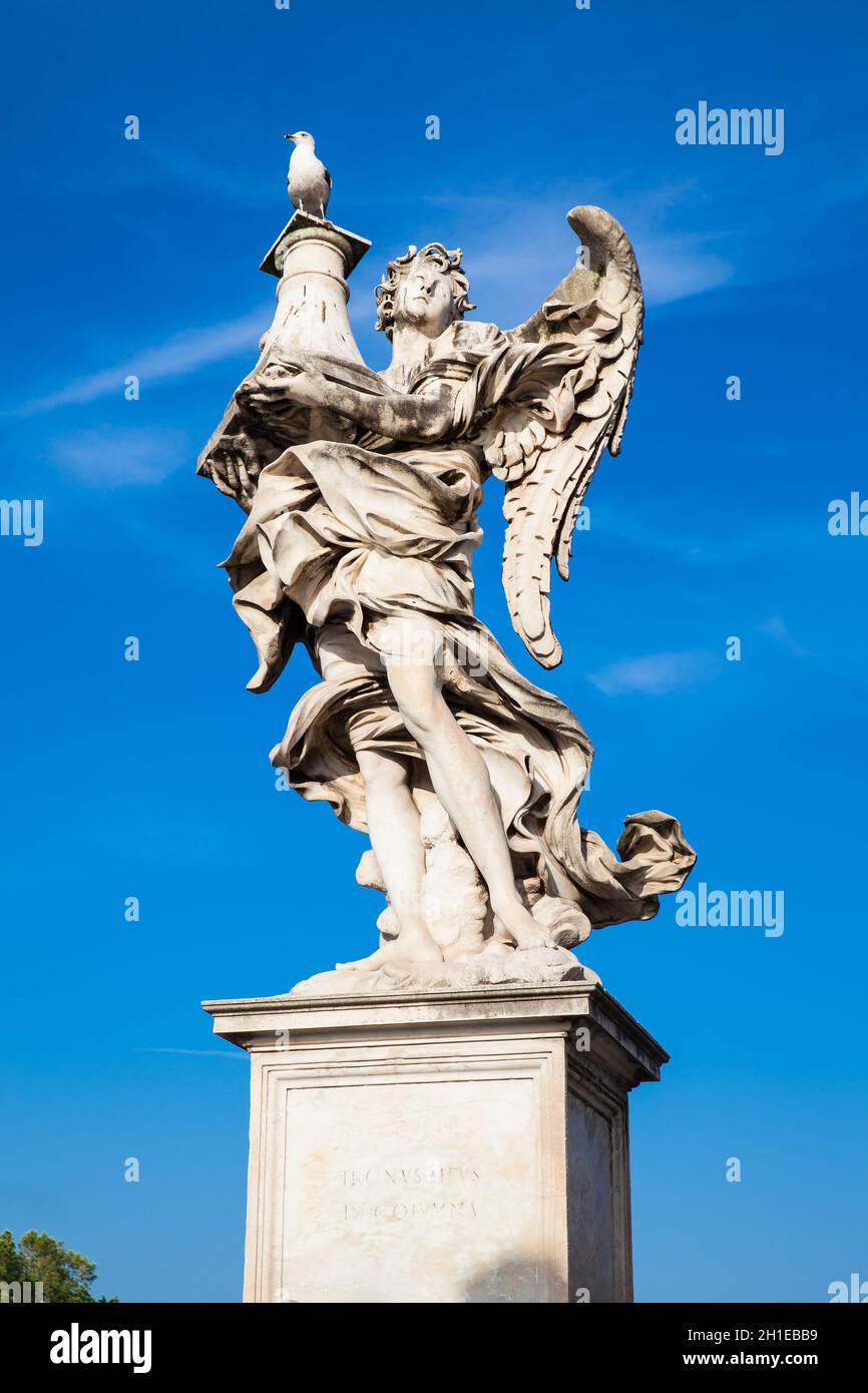 Beautiful Angel with the Column statue created by Antonio Raggi on the 16th century at Sant Angelo Bridge in Rome Stock Photo