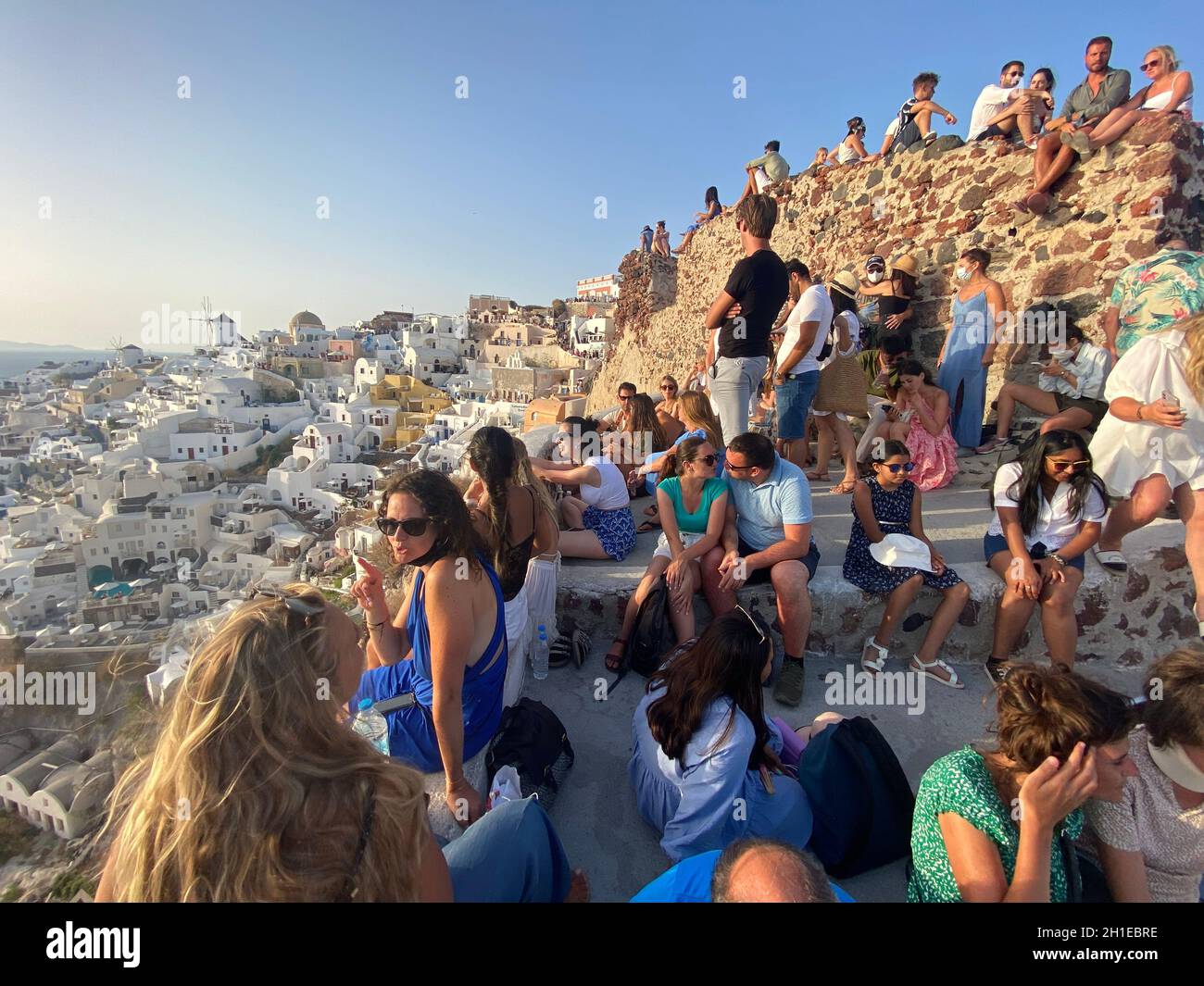 Santorini, Greece, August 2, 2021. Crowd waiting to photograph the