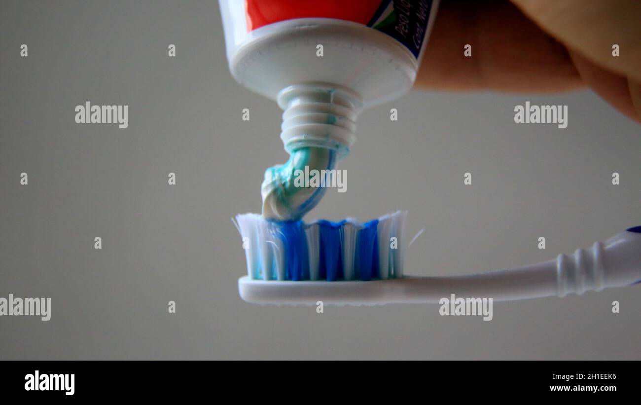 salvador, bahia / brazil - may 5, 2020: toothpaste is seen with a ...