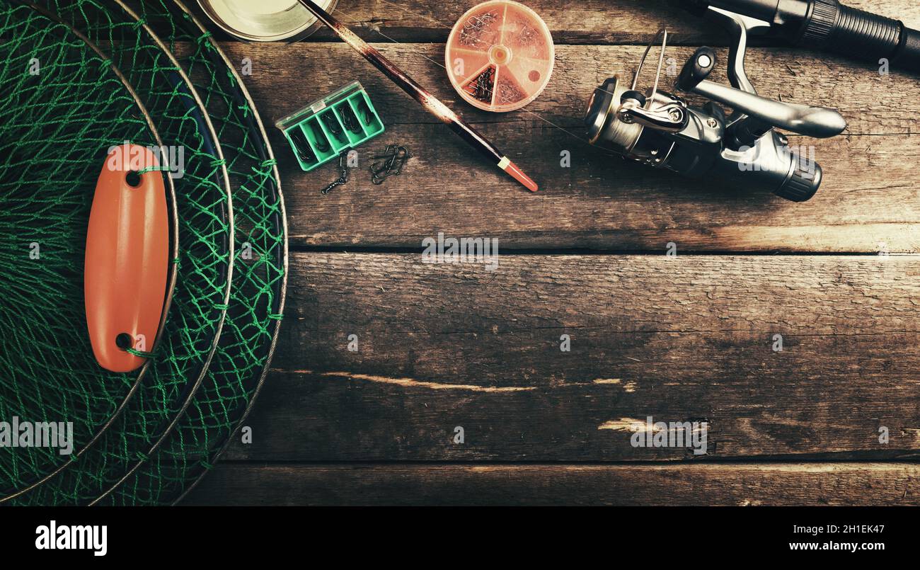 fishing tackle angling equipment on wooden background with copy space Stock Photo