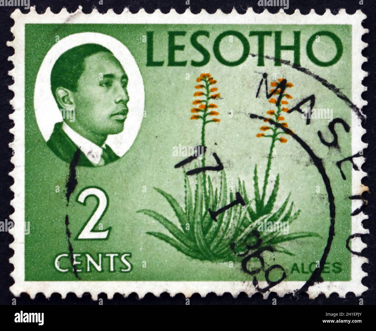 LESOTHO - CIRCA 1967: a stamp printed in the Lesotho shows King Moshoeshoe II and aloes, circa 1967 Stock Photo