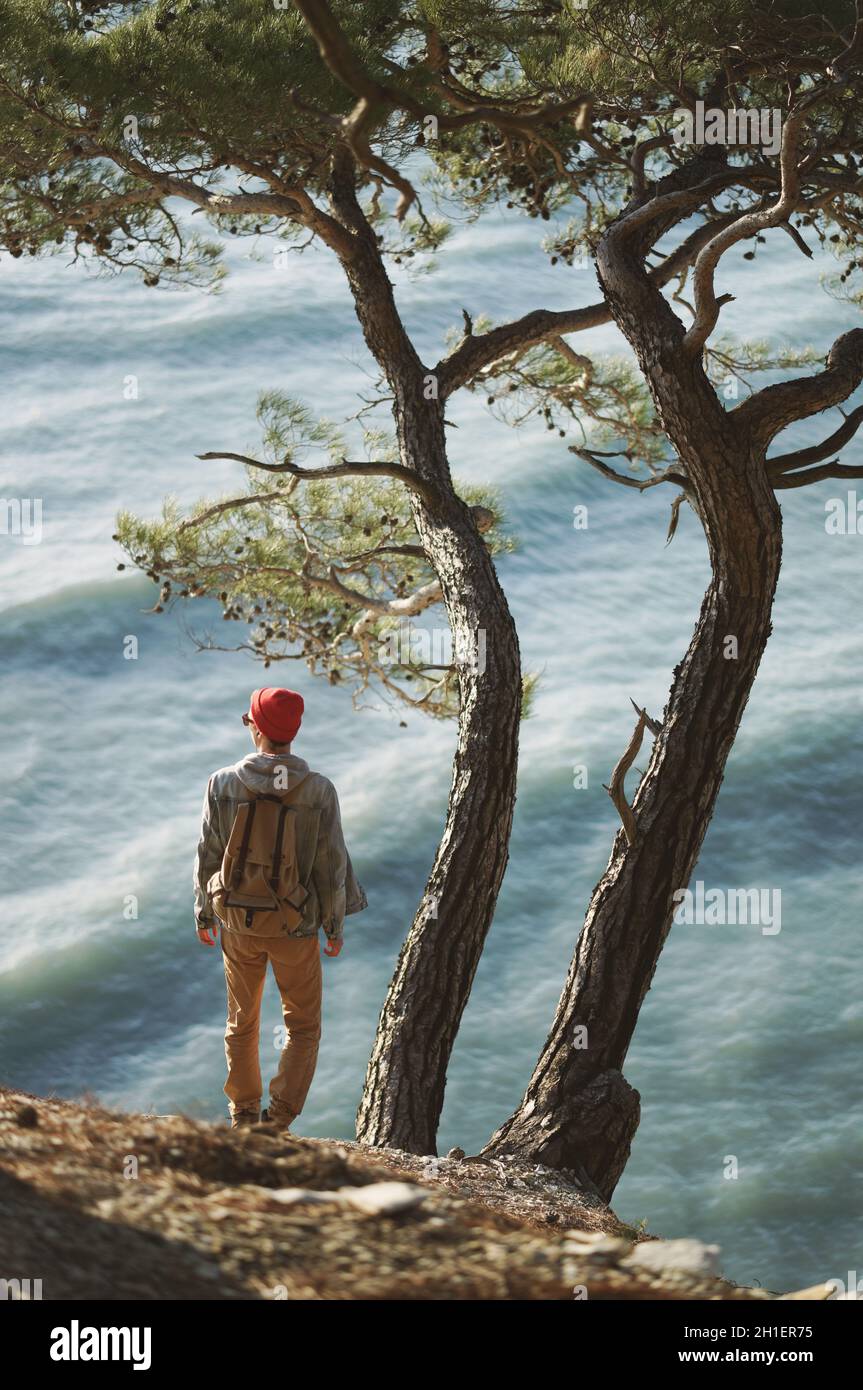 Young man staring at the sea Stock Photo Alamy