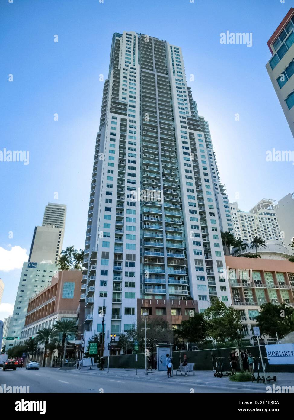 Miami, USA - November 30, 2019: Downtown Miami cityscape view with condos and office buildings against blue sky. Stock Photo