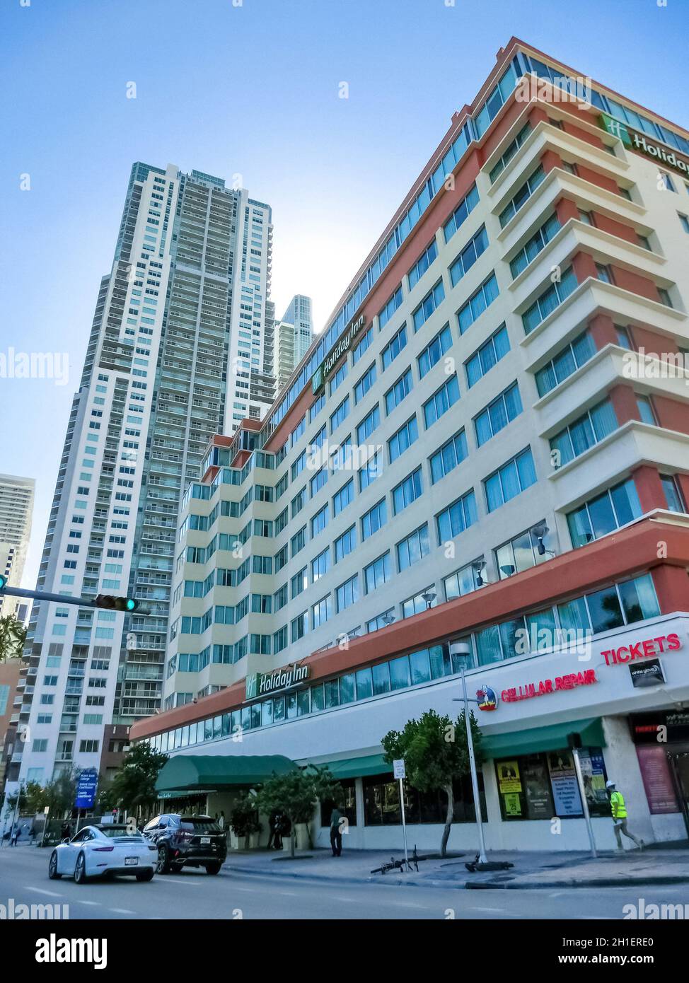 Miami, USA - November 30, 2019: Downtown Miami cityscape view with condos and office buildings against blue sky. Stock Photo