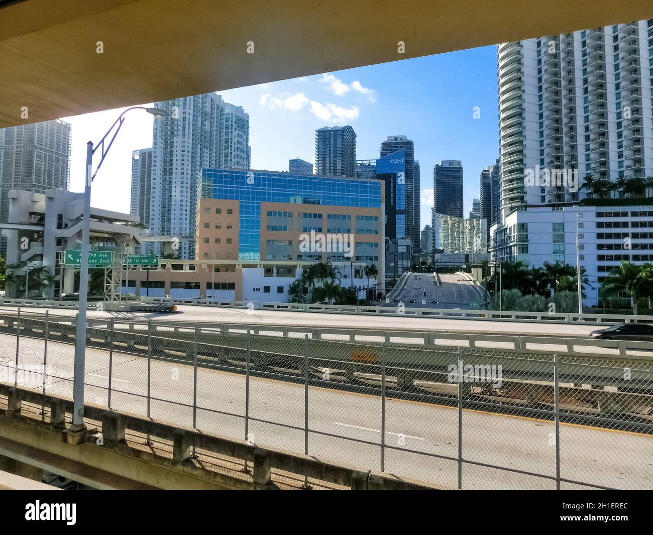 Miami, USA - November 30, 2019: Downtown Miami cityscape view with condos and office buildings against blue sky. Stock Photo