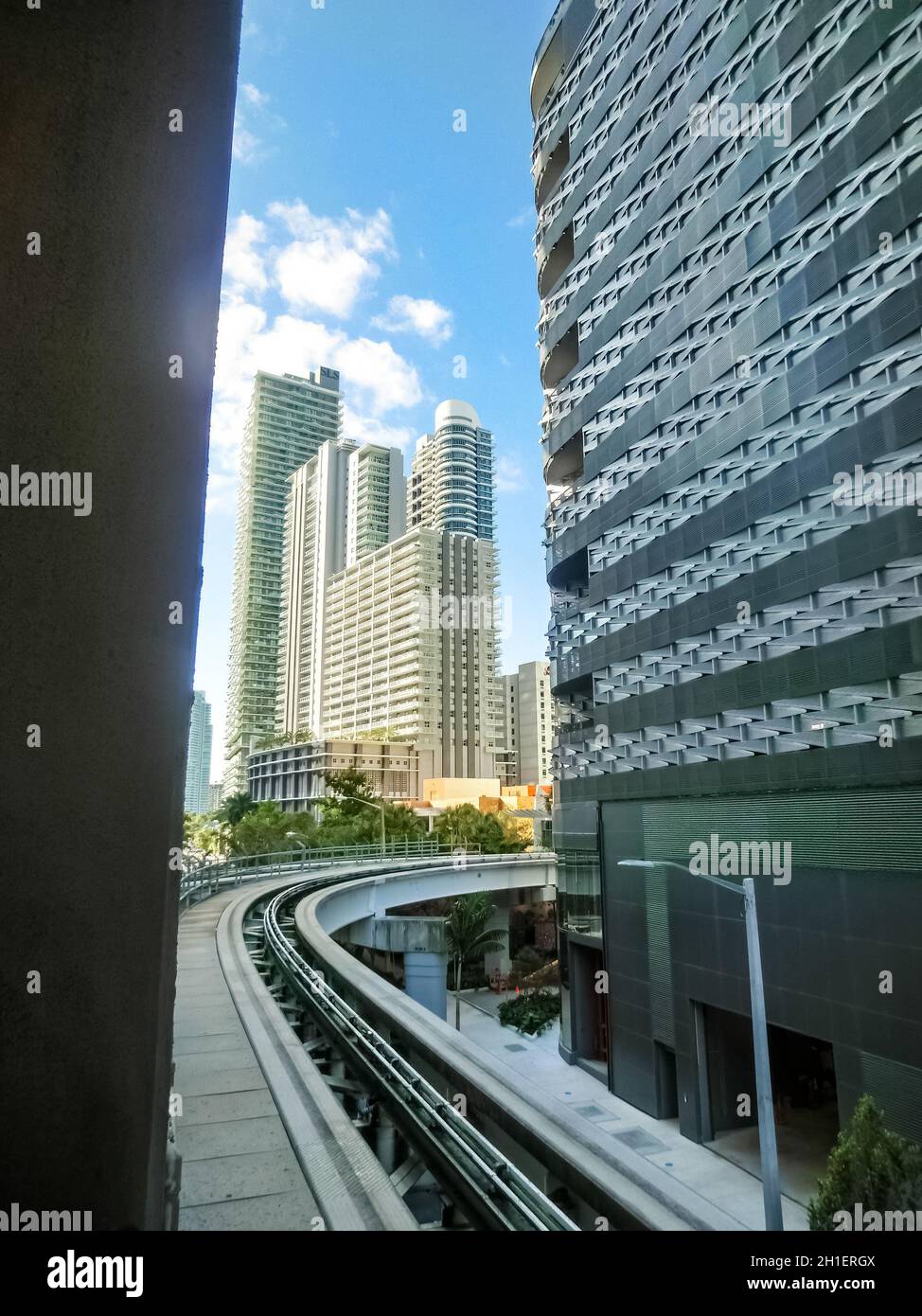 Miami, USA - November 30, 2019: Downtown Miami cityscape view with condos and office buildings against blue sky. Stock Photo