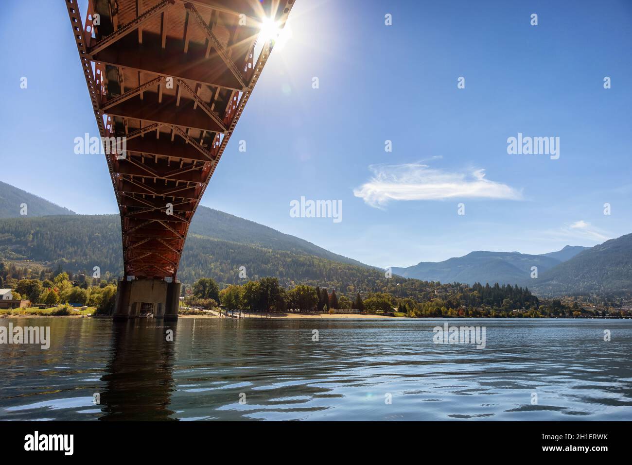 Big Orange Bridge over Kootenay River with Touristic Town Stock Photo