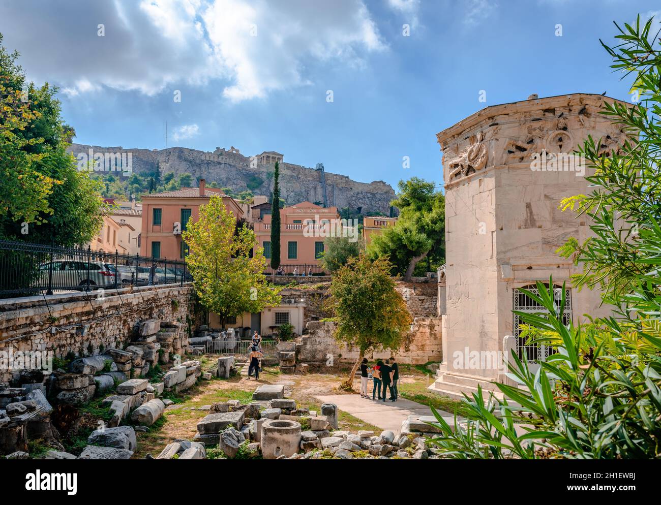 The Roman Agora in Athens, Greece,with the Acropolis in the background. The Tower of the Winds or the Horologion of Kyrrhestes dominates the picture. Stock Photo