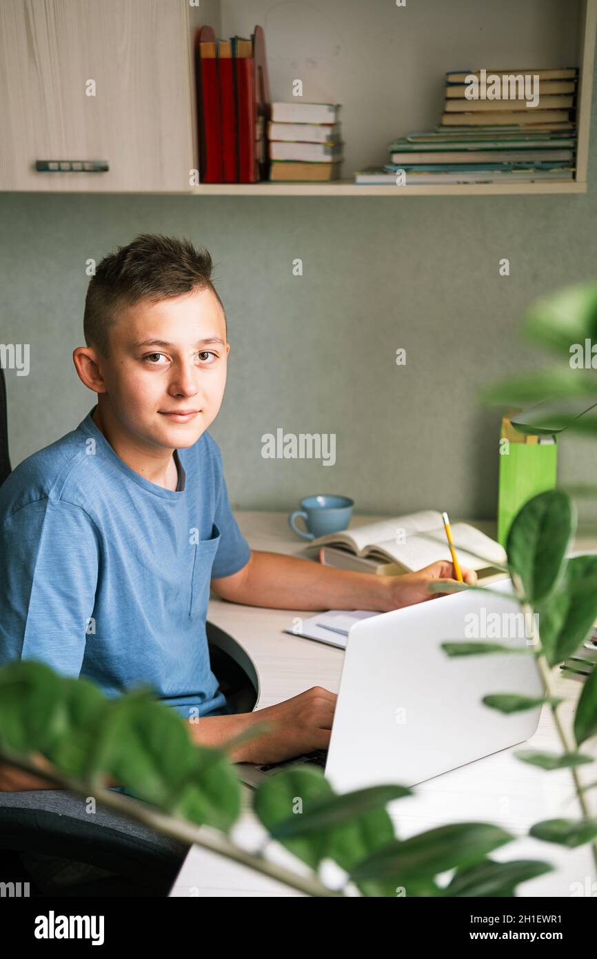 Laptop on the student's desk with the broadcast of the classroom Stock