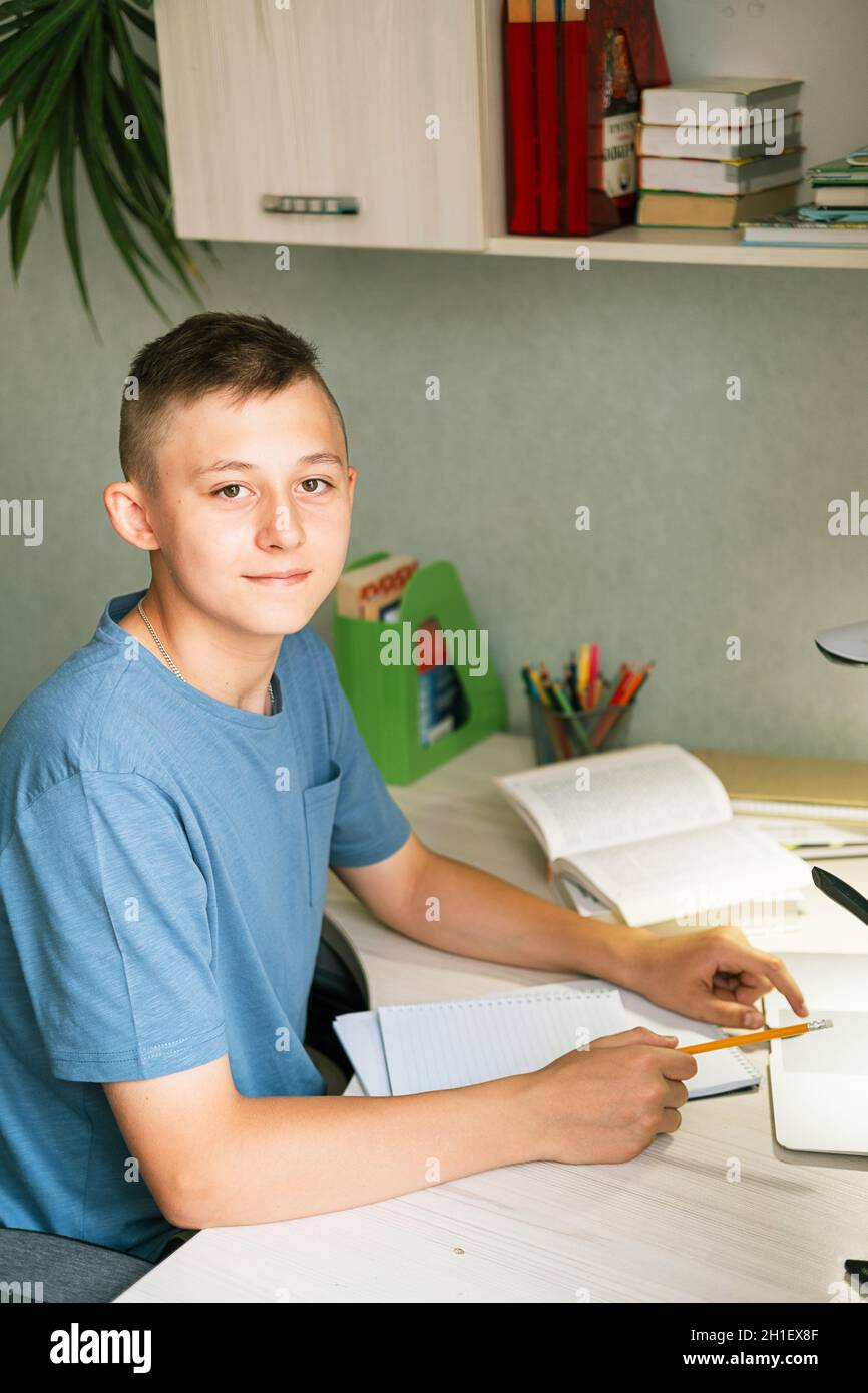 Laptop on the student's desk with the broadcast of the classroom Stock