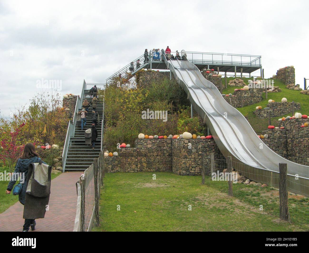 Klaistow, Germany - October 28, 2018: Children at playground with Halloween vegetable installation at modern outdoor park Klaistow farm, Germany on Oc Stock Photo