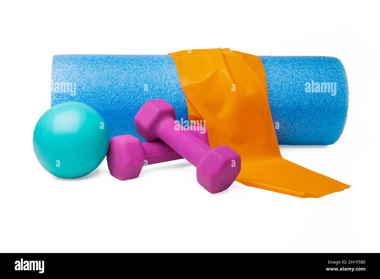 Exercise equipment including band, massage ball, dumbbellsand foam roller Stock Photo