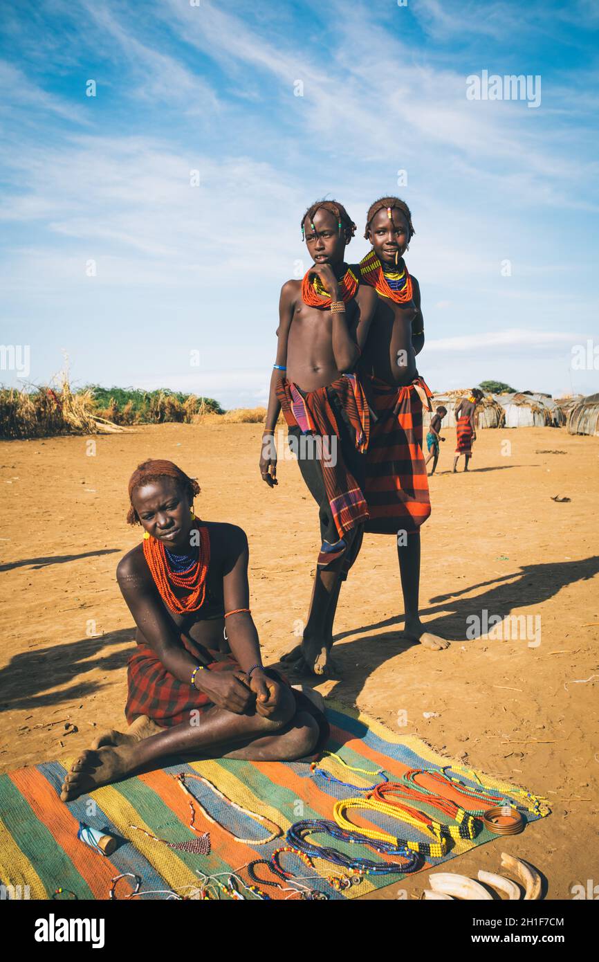 Omorate, Omo Valley, Ethiopia - May 11, 2019: Woman from the African tribe Dasanesh offering handmade souvenirs. Daasanach are Cushitic ethnic group i Stock Photo