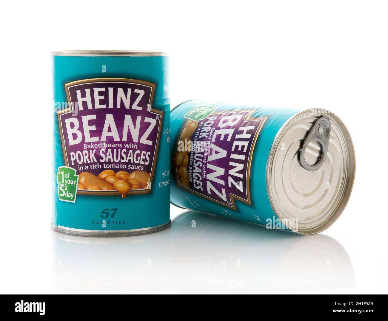 SWINDON, UK - JUNE 14, 2015: Two Tins of Heinz Beans with Pork Sausages Stock Photo