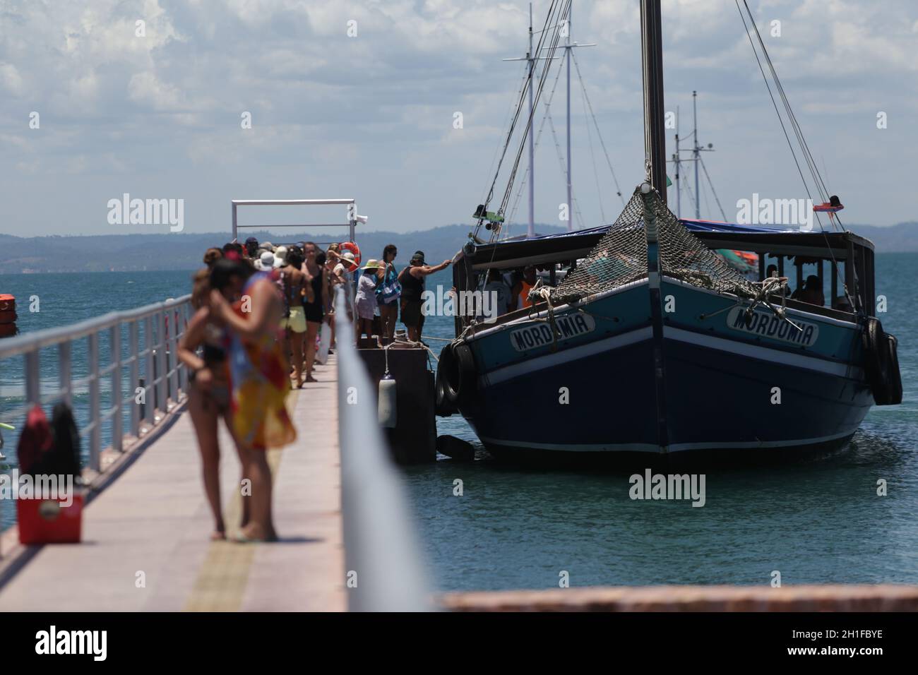 salvador, bahia / brazil  - january 31, 2019: Passengers are seen at the pier of Ilha dos Frades schooning for schooner for a nautical ride through th Stock Photo