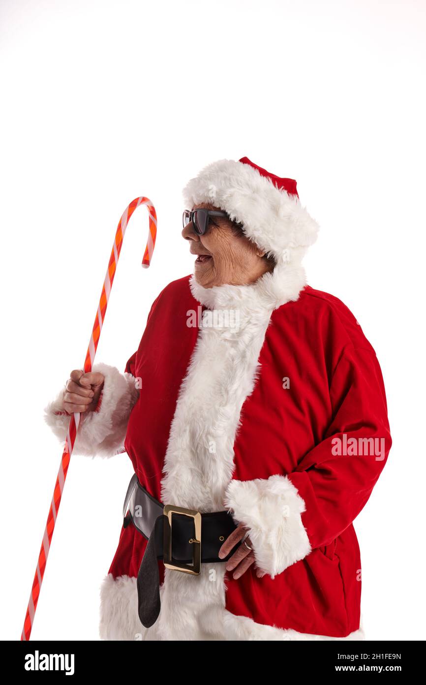A nonagenarian in a Santa Claus costume with a white background Stock Photo