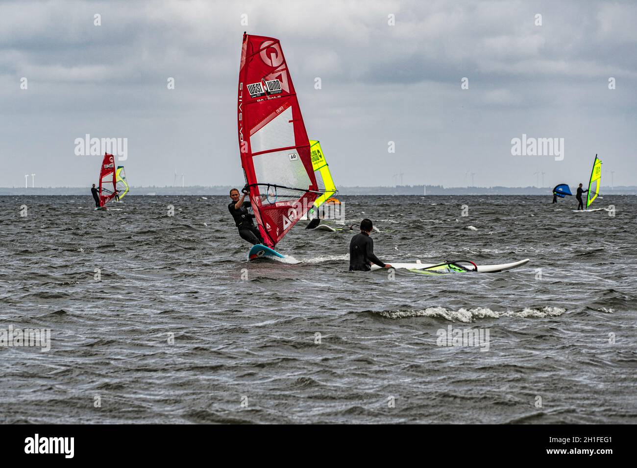 Windsurfing school in the waves of the North Sea. Denmark, Europe Stock Photo
