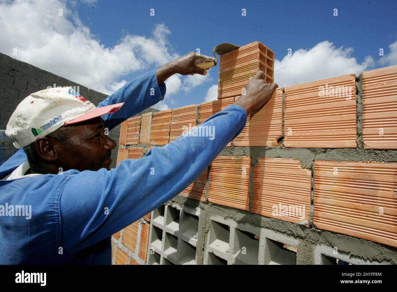eunapolis, bahia / brazil - March 30, 2011: Mason works on construction of popular houses in Federal Government popular housing program in the city of Stock Photo