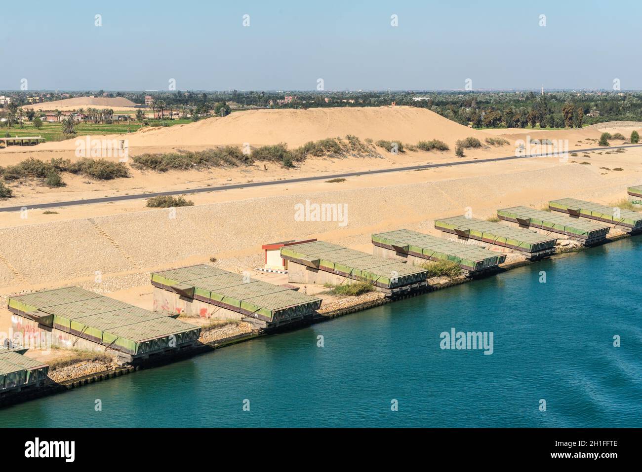 Ismailia, Egypt - November 5, 2017: Pontoons bridge for crossing the Suez Canal lie on the shore of canal near Ismailia, Egypt. Stock Photo