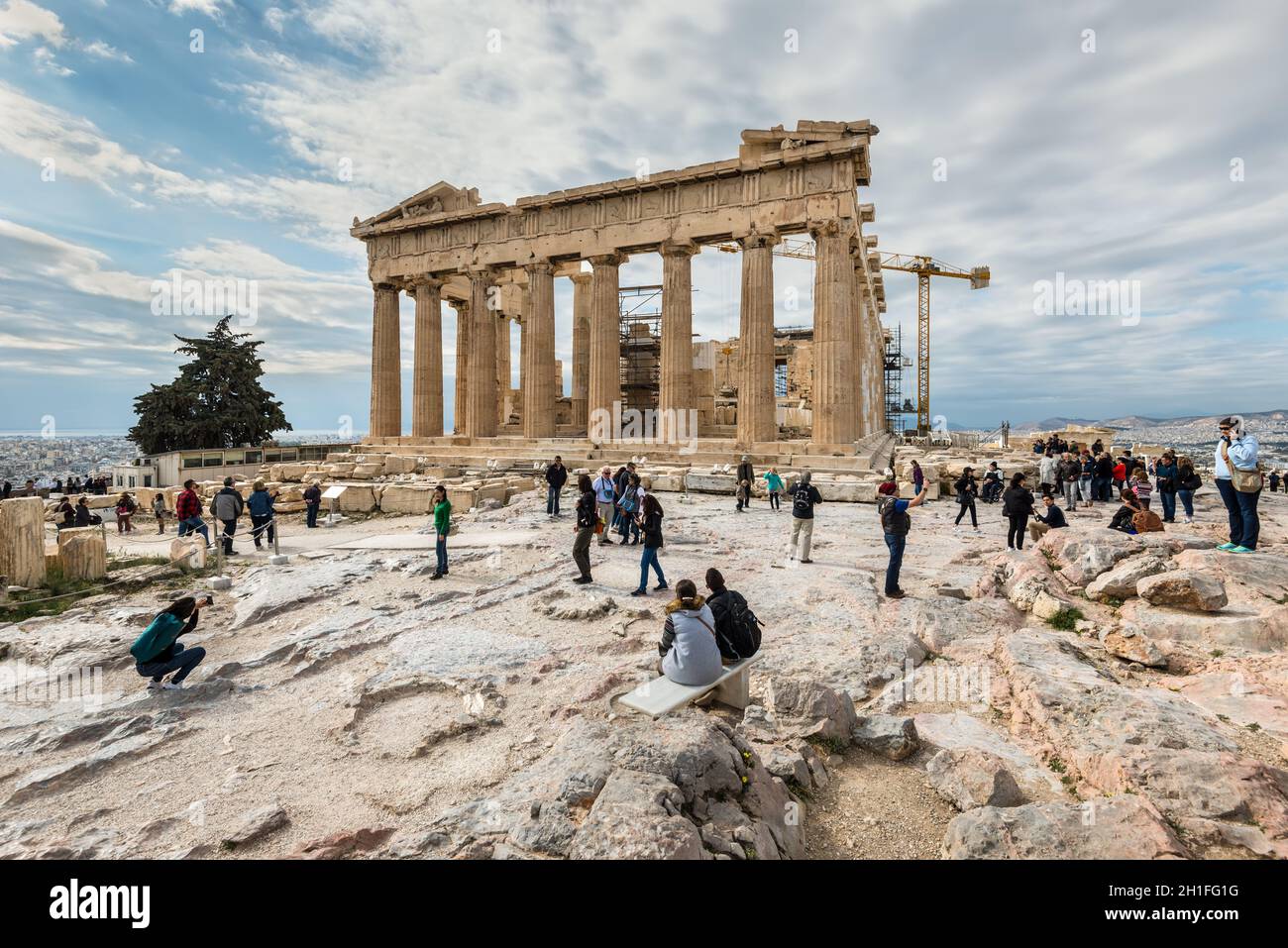 Athens, Greece - November 1, 2017: Many tourists visiting ancient temple Parthenon on Acropolis. Acropolis of Athens is an ancient citadel located on Stock Photo