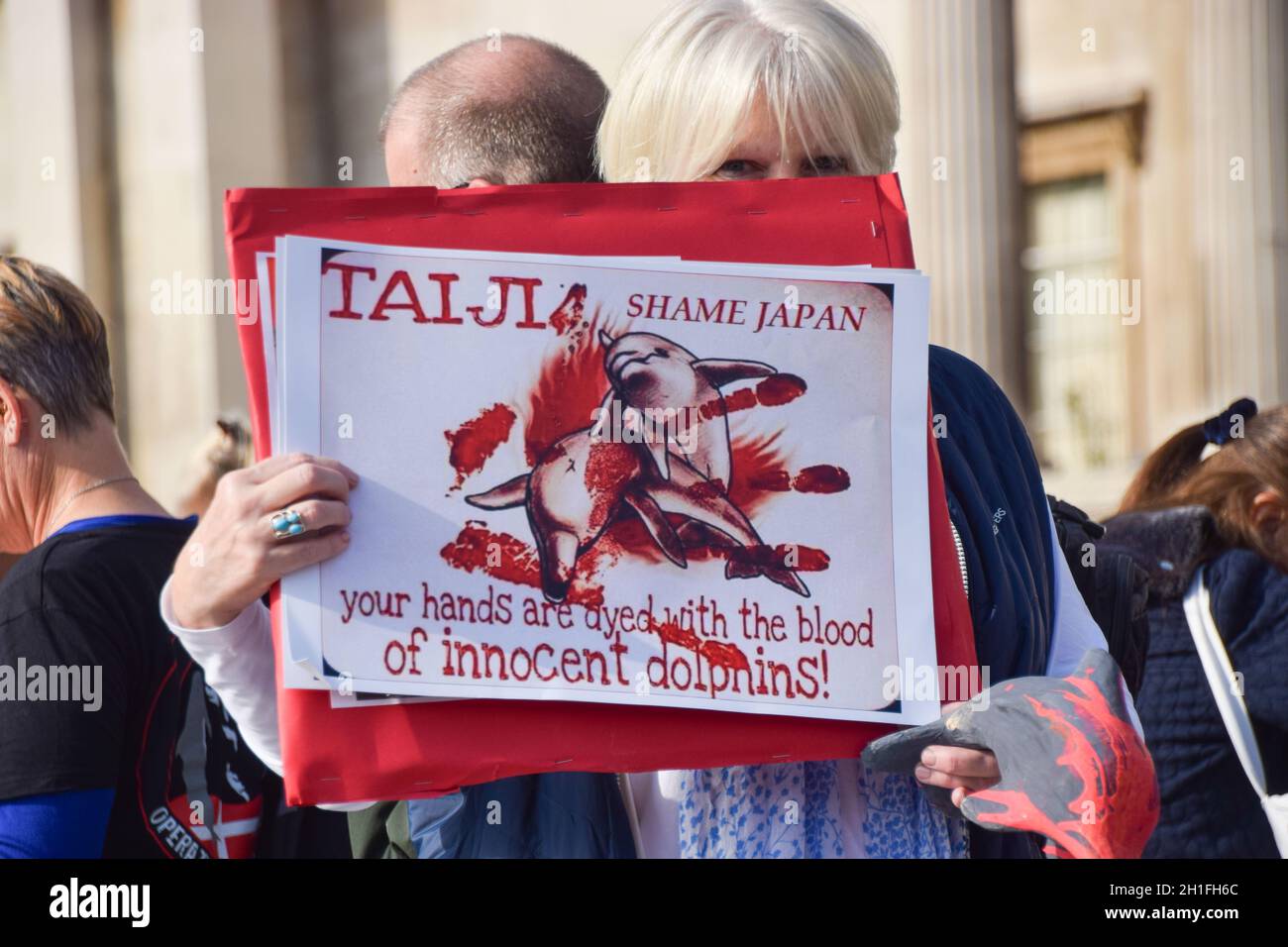 London, UK. 16th October 2021. Protesters in Trafalgar Square. Sea Shepherd and other activists marched through Westminster, calling for an end to the slaughter of dolphins and whales in Faroe Islands and Taiji, Japan. Stock Photo
