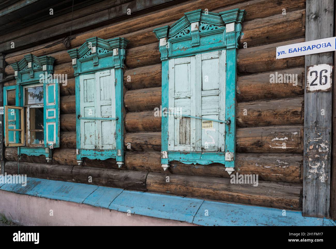 Traditional wooden house with colorful shutters in Ulan-Ude.Republic of Buryatia, Russia Stock Photo