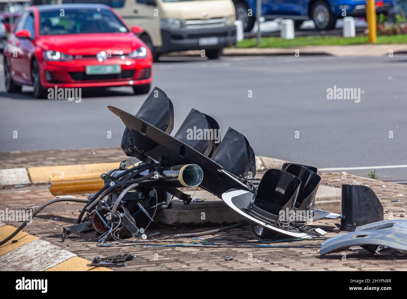 Road Traffic lights close-up destroyed broken on the floor vehicle collision at inter section. Stock Photo