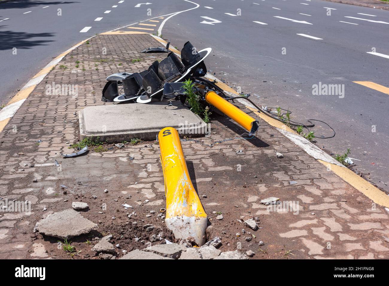 Road Traffic lights close-up destroyed broken on the floor vehicle collision at inter section. Stock Photo