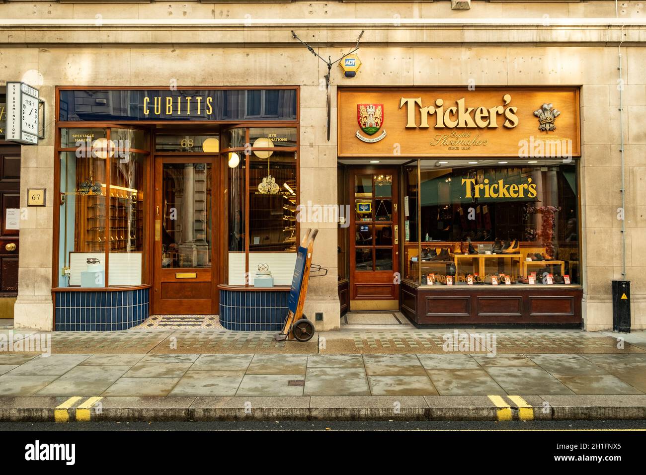 London- Trickers and Cubitts shops on Jermyn Street in St James. A shopping street famous for its upmarket luxury brands Stock Photo