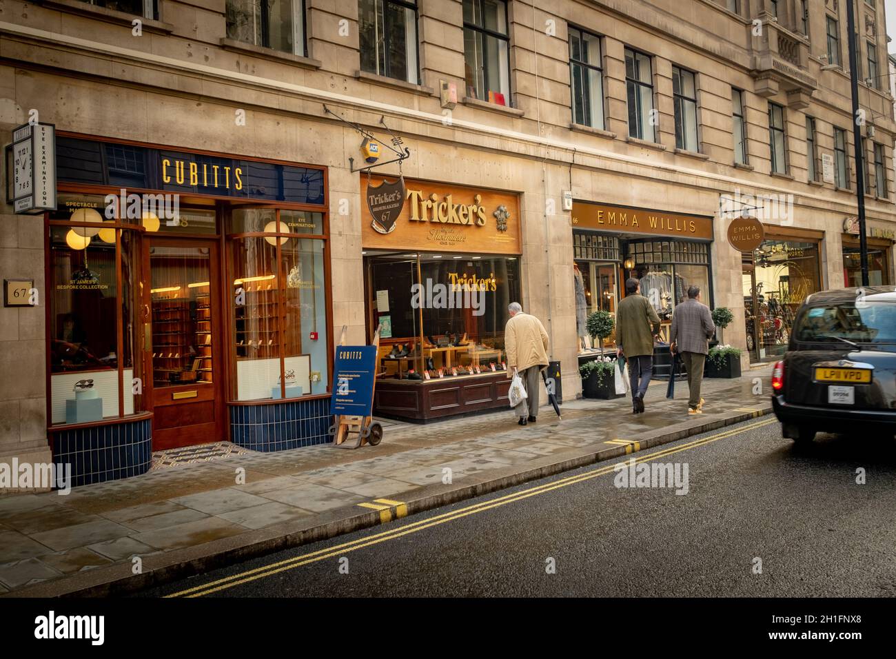 London- Trickers and Cubitts shops on Jermyn Street in St James. A shopping street famous for its upmarket luxury brands Stock Photo