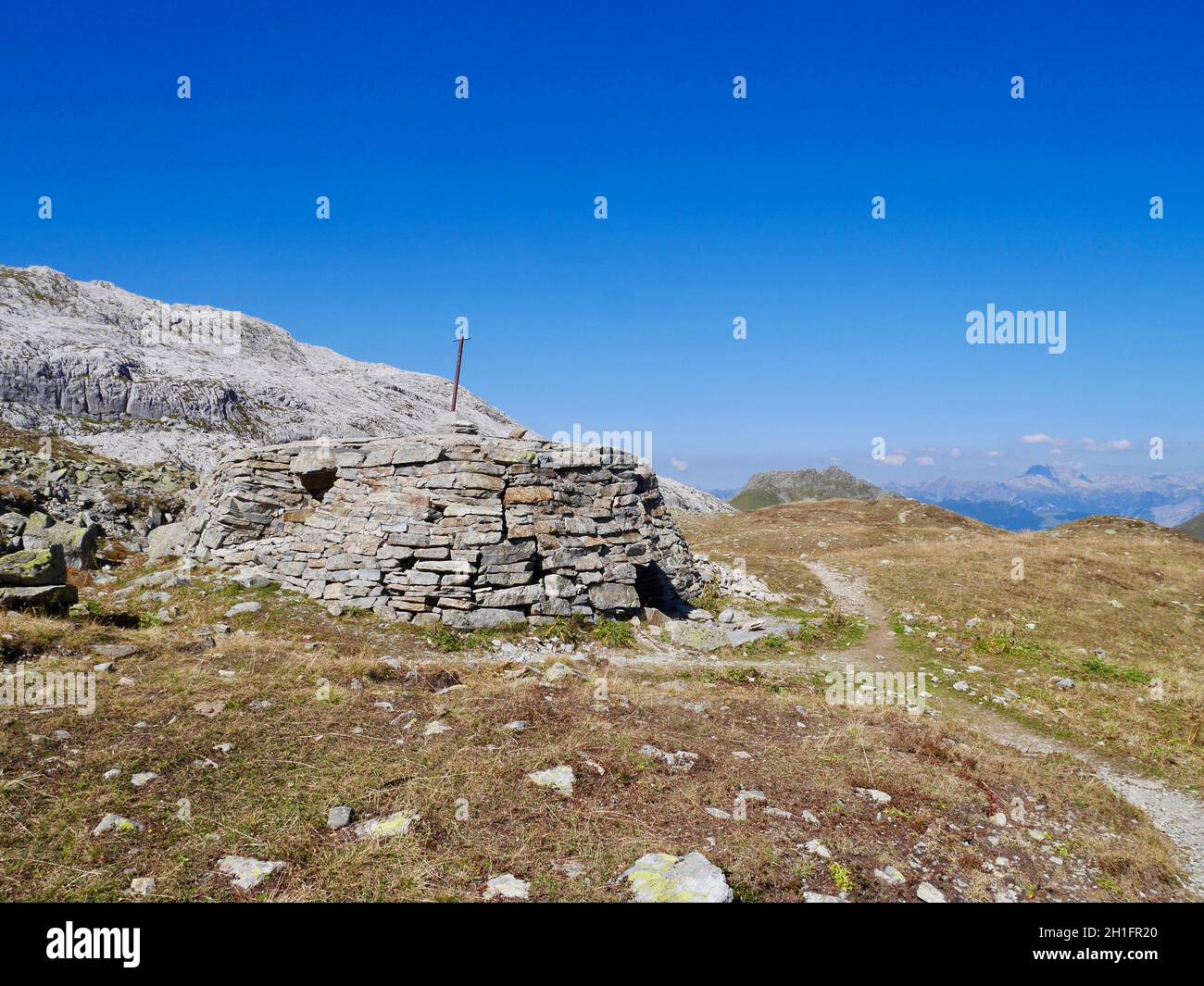 Stone hut in alpine landscape in Praettigau, Graubuenden, Switzerland. Stock Photo