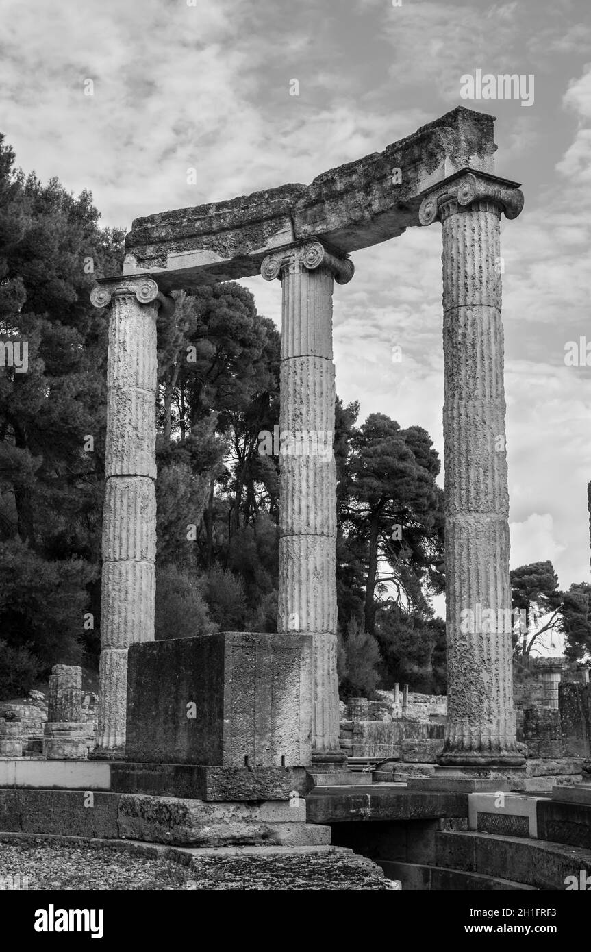 Archaeological Site of Ancient Olympia. The Philippeion in the Altis of Olympia was an Ionic circular memorial in limestone and marble. Black and whit Stock Photo