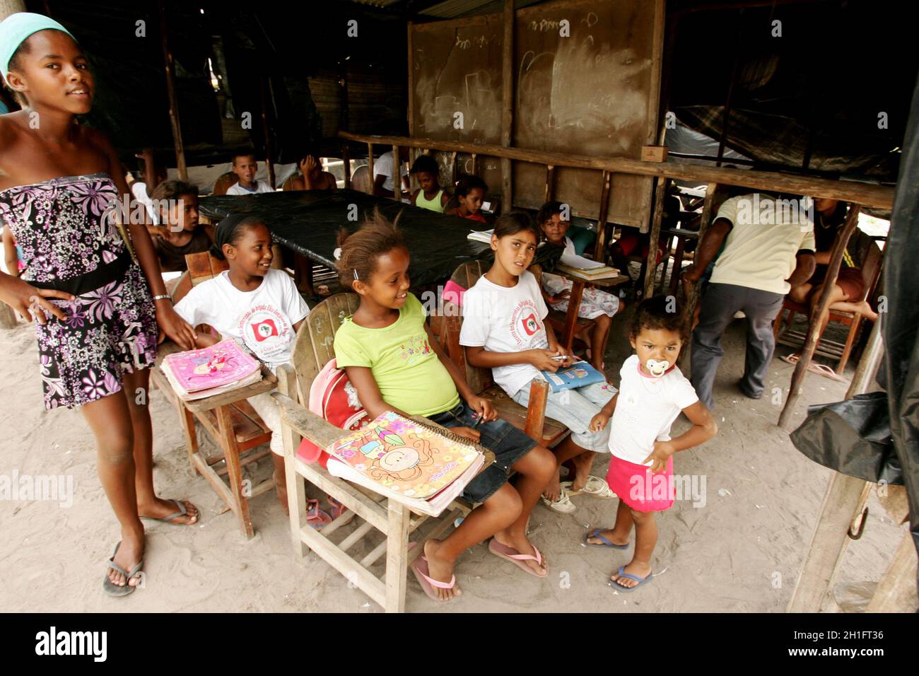 members of the Landless Movement (MST) are seen in a makeshift classroom at a social movement camp along the BR 101 highway in the city of Eunapolis. Stock Photo