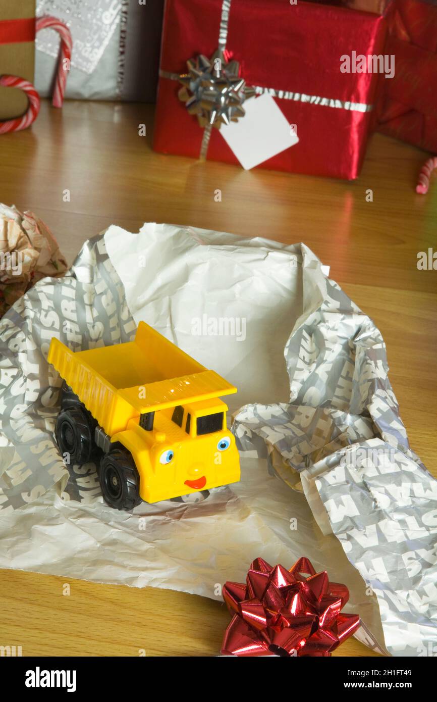 Childrens Toy Christmas present unwrapped Stock Photo