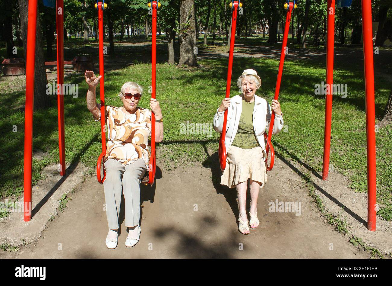 Older woman swinging hi-res stock photography and images - Alamy