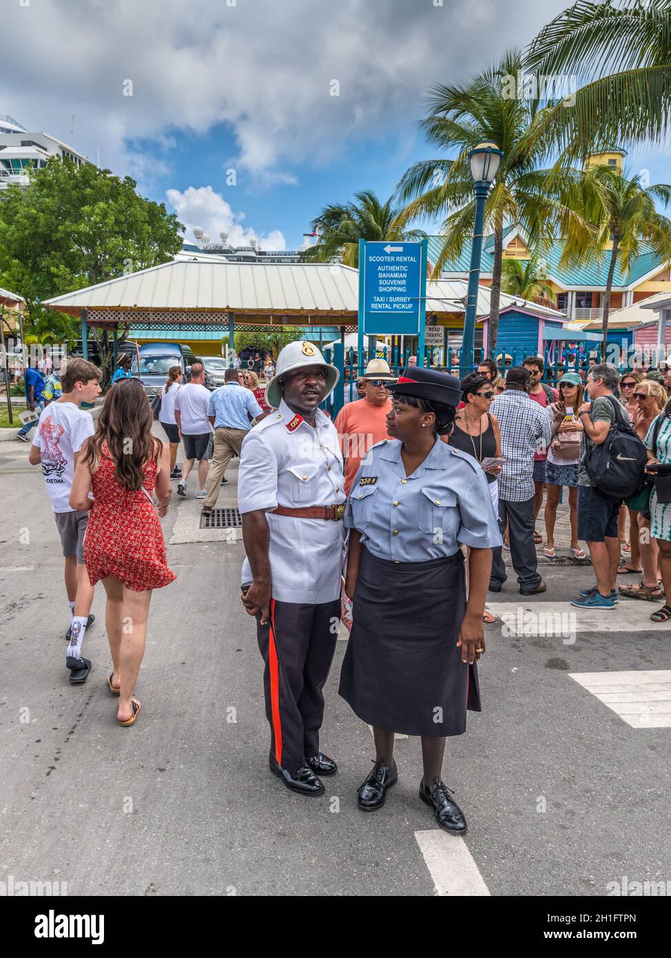 Nassau, Bahamas - May 3, 2019: Two Royal Bahamas Police officers (Man and woman) are keeping order in the streets. Nassau sees thousands of visitors d Stock Photo