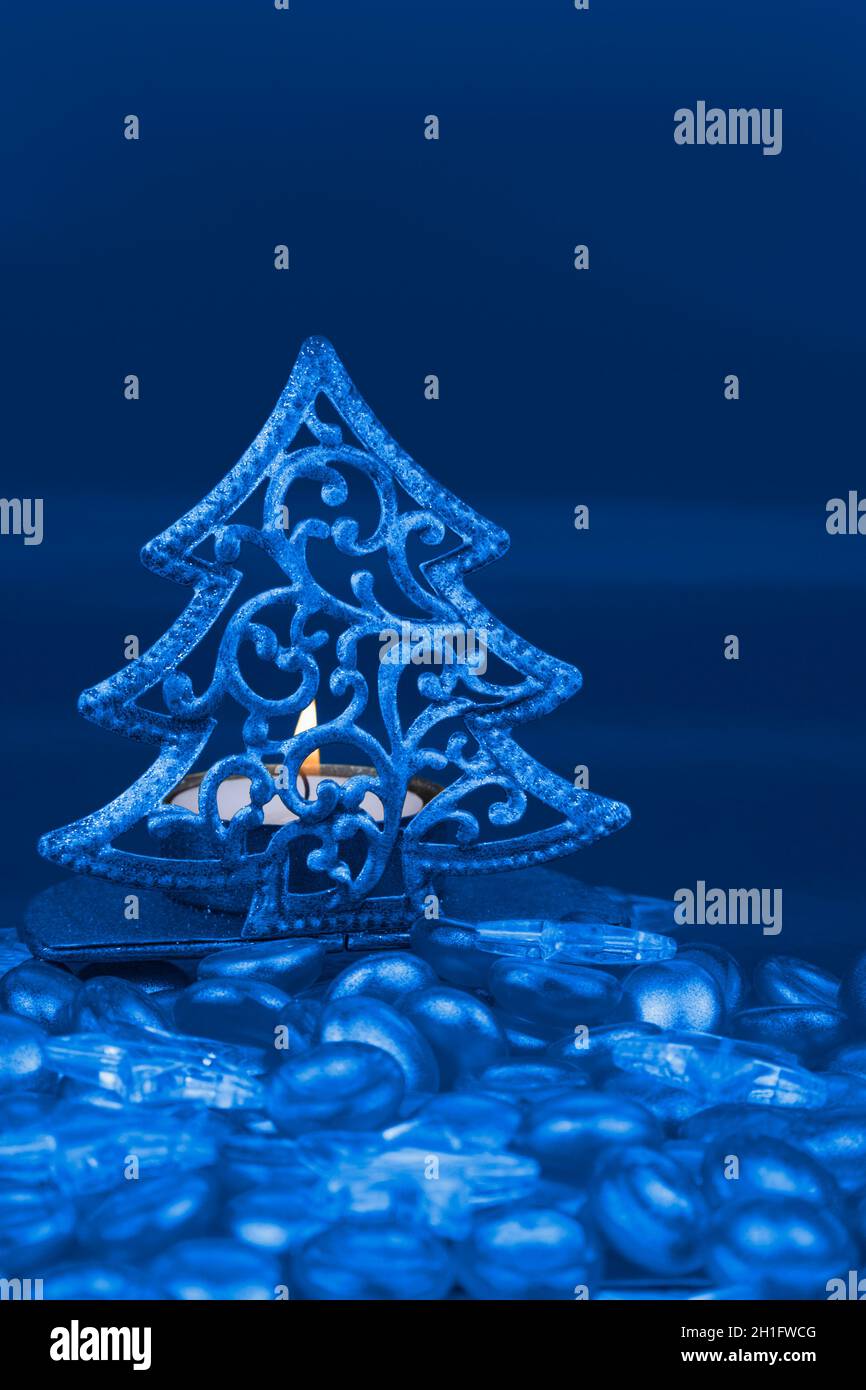 Christmas tree shaped tea light holder with blue clear glass stars and