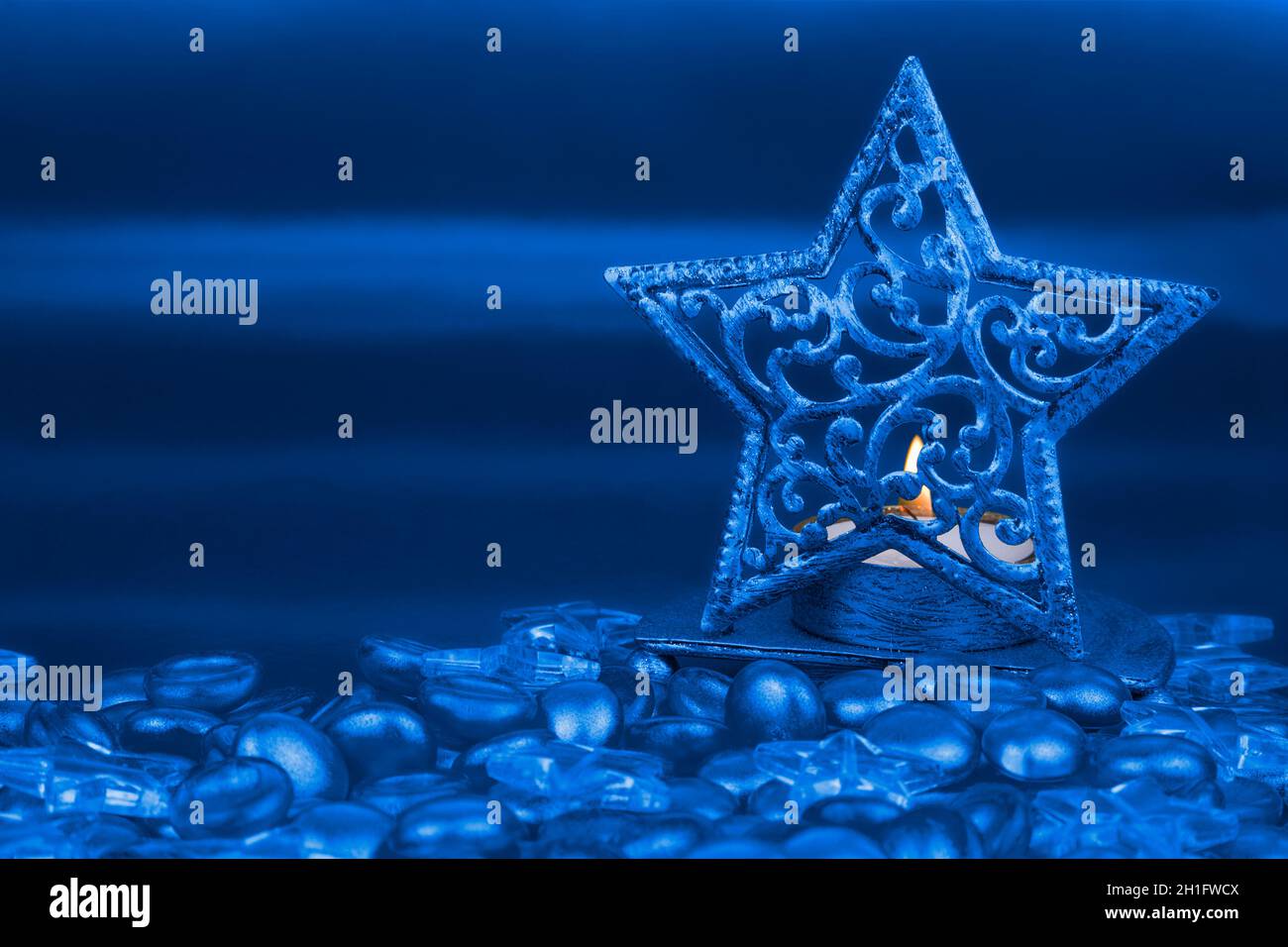 Christmas star shaped tea light holder with blue clear glass stars and