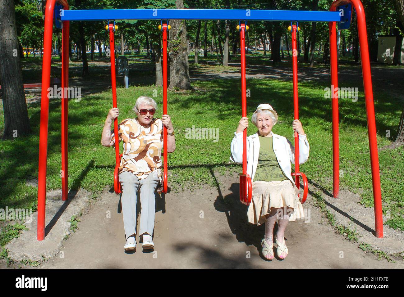 Older woman swinging hi-res stock photography and images - Alamy
