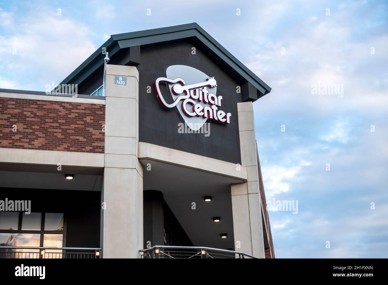 Redmond, WA USA - circa August 2021: Low angle view of the entrance to a Guitar Center store downtown. Stock Photo