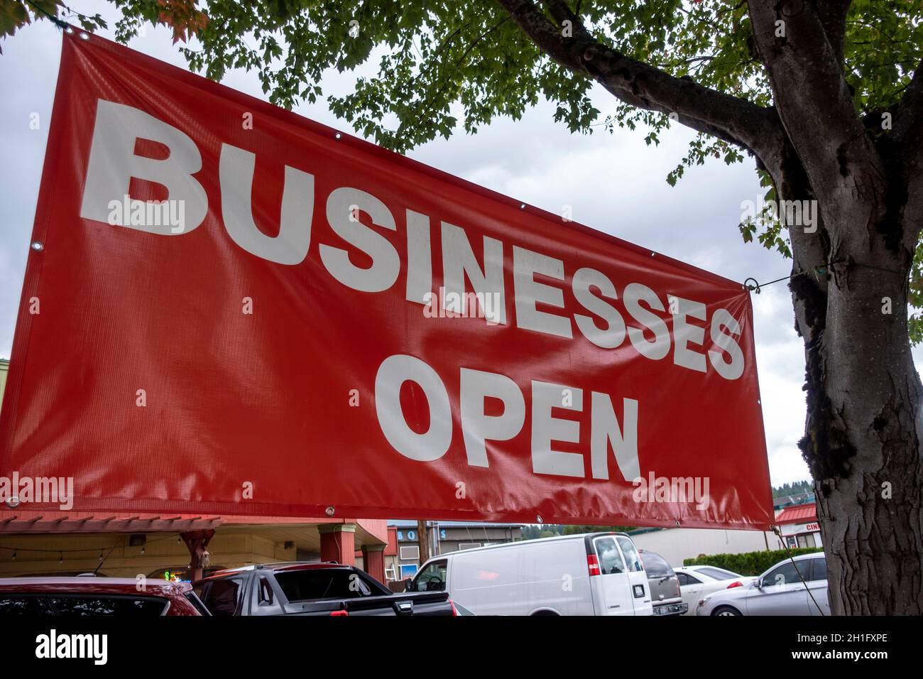 Problem Businesses Open Sign Woodinivlle, WA USA - circa September 2021: Low angle view of a ...